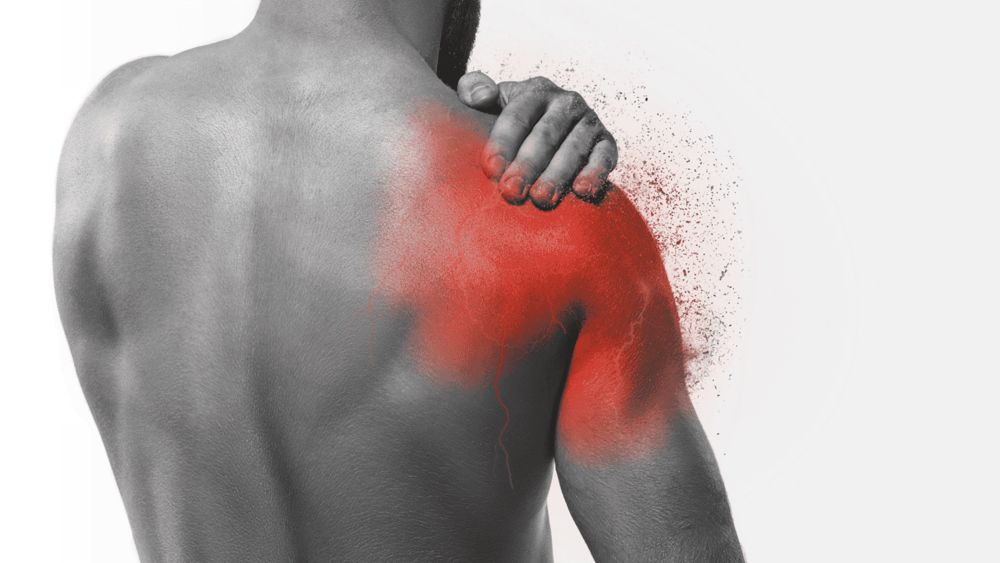 Man holding a painful shoulder, a common reason for shoulder pain treatment in Oakville